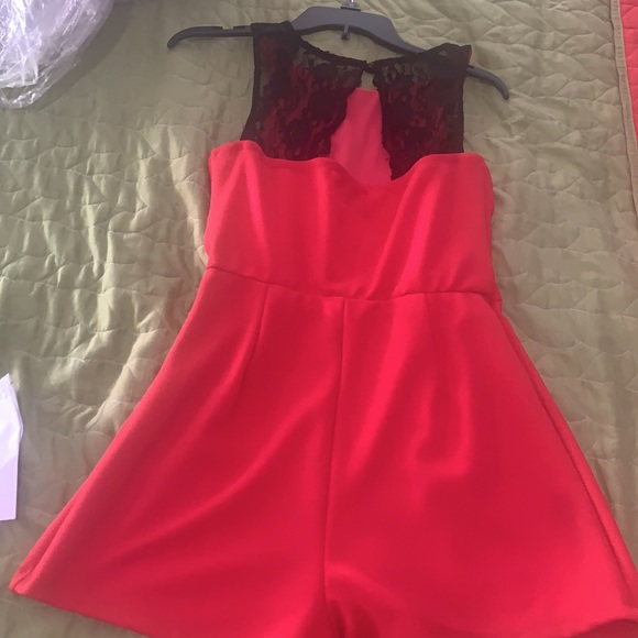Coral dressy Coral romper with black lace in the back . - Picture 3 of 3